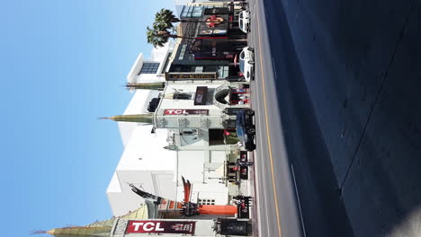 Vertical-Video,-Hollywood-Boulevard-Walk-of-Fame,-TCL-Chinese-Theatre,-Traffic-on-Sunny-Day,-Los-Angeles,-California-USA