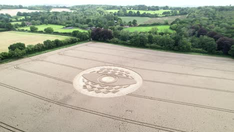 Aerial-view-circling-West-Meon-symbolic-crop-circle-in-Hampshire-agricultural-farmland-countryside