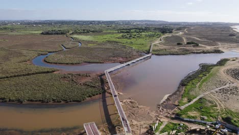 Aerial-view-of-wooden-walkway-in-Nature-Reserve-Armacao-de-Pera,-Portugal