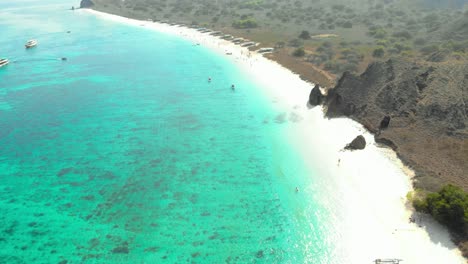 turquoise-water,-sandy-beach-and-steep-Hills-Of-The-Pink-Beach-On-Padar-Island-in-Komodo-National-Park,-Indonesia