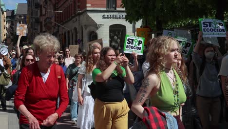 Young-and-old-women-march-at-climate-protest-rally-in-Sweden,-slo-mo