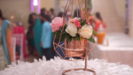 Floral-Arrangements-in-Hanging-Pots-as-Decorations-at-an-Indian-Wedding-Reception---Close-Up