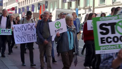 Elderly-protesters-march-at-environmental-rally-on-street-in-Stockholm