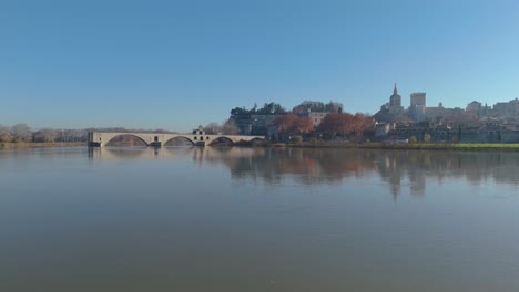 Aerial-establishing-shot-of-Pont-St-Bénézet-with-Palais-des-Papes-behind