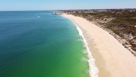 Aerial-view-over-beautiful-Mindarie-Beach-looking-towards-the-harbour,-Perth-Australia