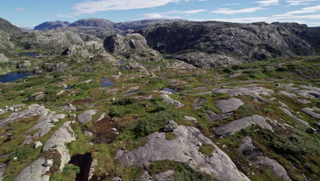 Aerial-shot,-soaring-over-a-series-of-small-lakes-in-Norway