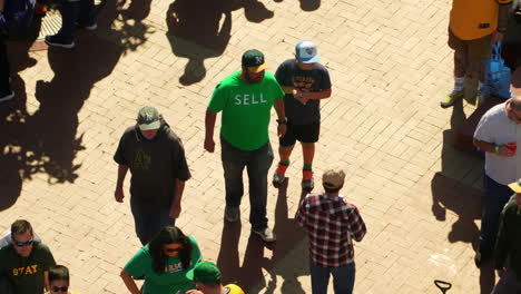 Man-In-Green-SELL-Shirt-At-The-Athletics-Fan-Fest-In-Oakland,-California