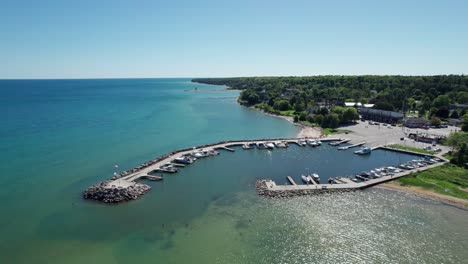 Slow-drone-aerial-view-of-a-marina-in-Bailey's-harbor,-Wisconsin