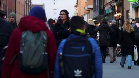 Slo-mo-of-people-walking-on-pedestrian-street-in-Stockholm,-Sweden