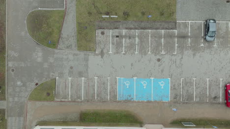 Aerial-top-down-of-parking-lot-with-handicapped-parking-in-Poland
