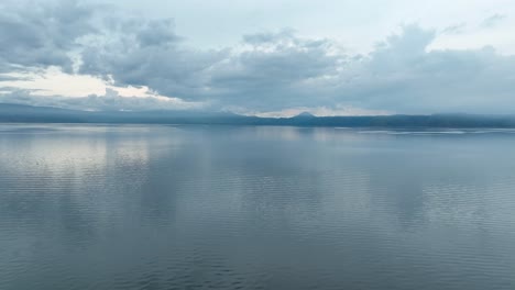 Still-reflections-of-the-skyline-over-picturesque-Lake-Toba