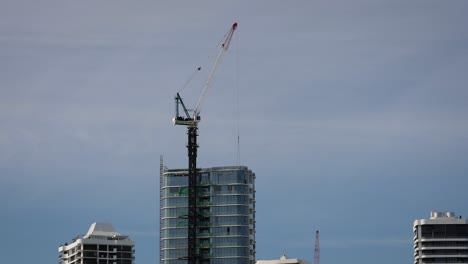 Medium-view-of-McNab-crane-on-construction-site,-Gold-Coast,-Australia