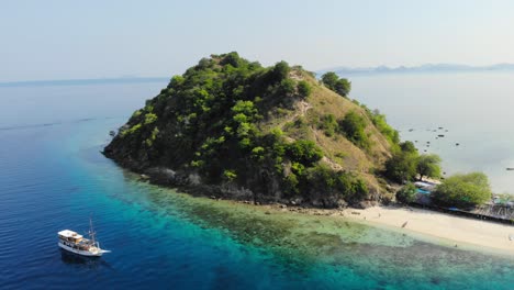 Pulau-Kelor-island-in-Indonesia,-shot-from-a-drone-circling-around-it-to-showcase-its-beauty-from-all-angles