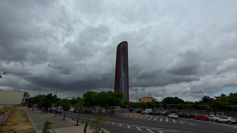 Revealing-shot-of-Sevilla's-modern-tower-as-dark-clouds-loom-over