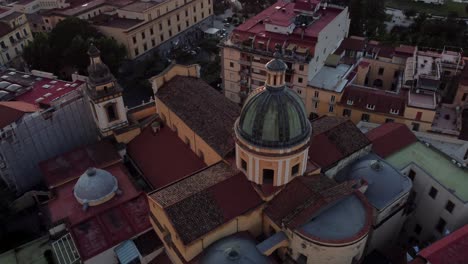 Drone-shot-of-a-dome-in-Castellammare-Di-Stabia-during-sunset