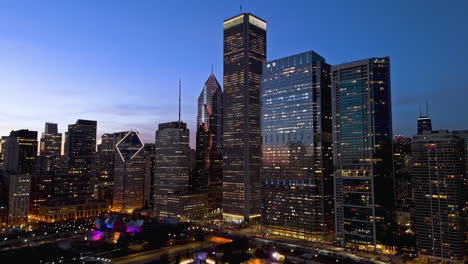 Millennium-Park-and-skyscrapers-of-New-Eastside,-dawn-in-Chicago---Aerial-view