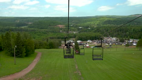 Descending-from-mountain-in-chairlift-on-in-Mont-Du-Lac-Resort-,-USA