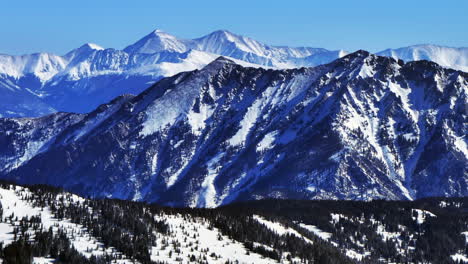 Vail-Pass-Colorado-aerial-drone-landscape-i70-Copper-Mountain-Silverthorne-Frisco-Grays-and-Torreys-Tenmile-peak-sunny-winter-morning-fresh-snow-blue-sky-Rocky-Mountains-Continental-Divide-upward