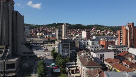 Aerial-View-of-Downtown-Uzice,-Serbia,-Buildings-and-Square-on-Sunny-Summer-Day