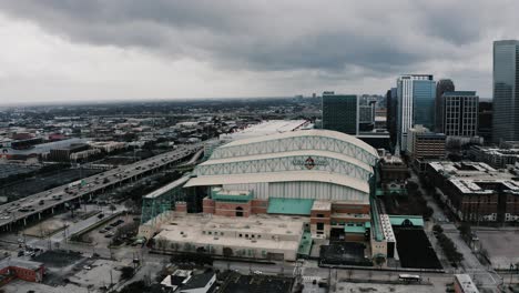 Drone-shot-pulling-away-from-Minute-Maid-Park,-nicknamed-The-Juice-Box