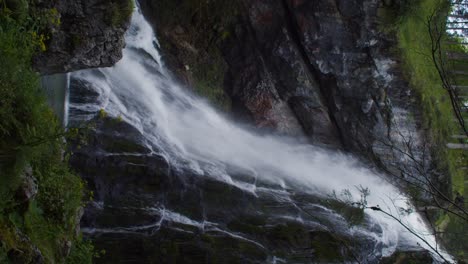 Vertical-shot-of-wonderful-large-waterfall-in-Austria-Gollinger,-refreshing