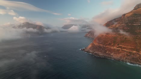 Cape-Town,-South-Africa---A-Stunning-Vista-of-Noordhoek-and-Chapman's-Peak-Drive-During-the-Sunset---Aerial-Drone-Shot