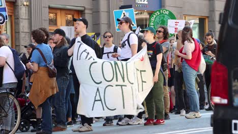 Young-protesters-at-climate-rally-with-Fridays-for-Future-sign,-static