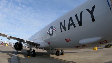 Tilt-up-reveal-of-a-US-Navy-cargo-jet-on-the-ground