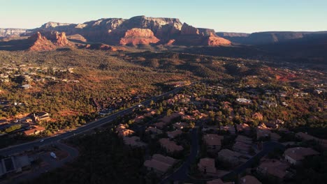 Aerial-View-of-Sunrise-Above-Sedona,-Arizona-USA,-Red-Rock-Hills-and-Valley,-Drone-Shot