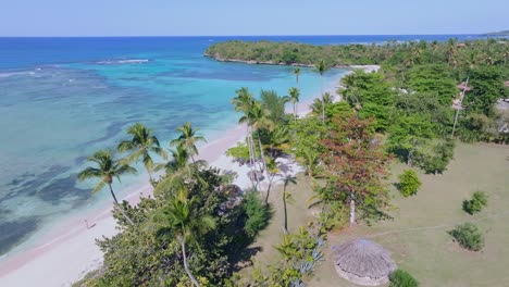 People-at-Playa-La-Playita-beach-at-Las-Galeras-in-Samana-peninsula,-Dominican-Republic