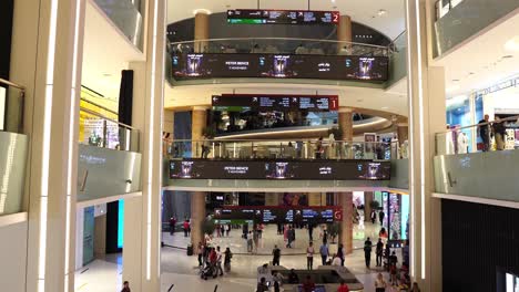 The-Dubai-Mall,-People-and-Shops-in-Biggest-Shopping-Mall-in-Emirates,-View-From-Escalator