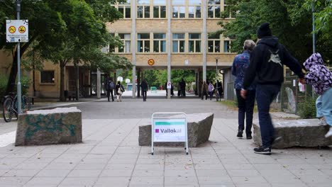 Family-walks-toward-polling-station-to-vote-on-Swedish-election-day