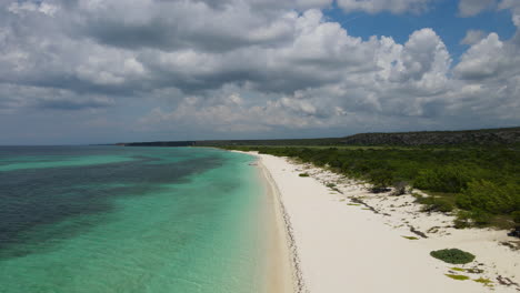 Beautiful-sandy-beach-with-clear-Caribbean-sea-water-and-coral