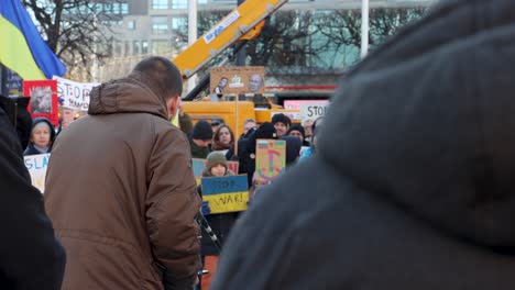 Young-man-speaks-by-microphone-at-rally-against-war-in-Ukraine,-Sweden