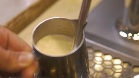 Guy-Making-Hot-Milk-Before-Making-a-Cappuccino-in-a-French-Coffee-Shop-in-the-Morning