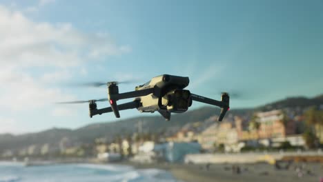 DJI-Mavic-3-Pro-modern-quadcopter-drone-in-static-flight-with-sea-in-background,-close-up