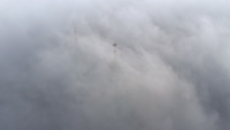 Dense-fog-over-Wawel-Castle-in-Krakow,-Poland-with-slightly-visible-tower