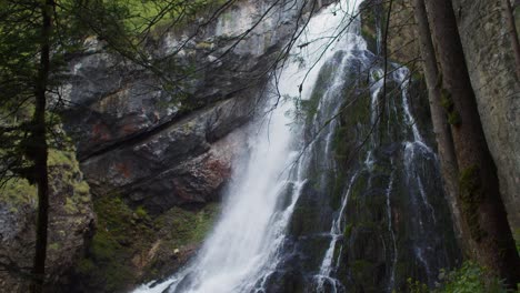 Sensational-tilt-down-establisher-shot-of-Gollinger-Waterfall-in-Austria,-summer
