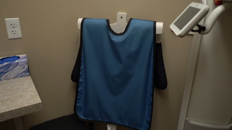 Blue-lead-apron-x-ray-protection-vest-in-dental-operatory-room-and-dental-clinic