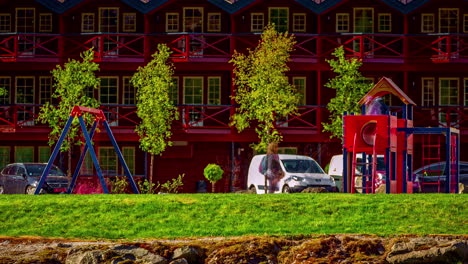 A-playground-in-front-of-typical-norwegian-houses-in-a-time-lapse-shot