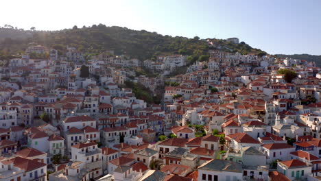 Aerial:-Skopelos-town-in-Skopelos-Island,-Greece-during-golden-hour