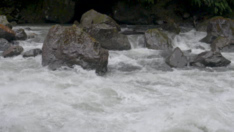 Slow-motion-footage-of-rushing-river-rapids-after-a-storm---Milford-Sound-,-New-Zealand