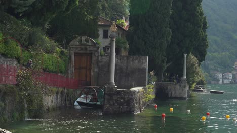 Private-Boat-is-Parked-near-the-Coast-of-Varenna-Town-in-Lake-Como