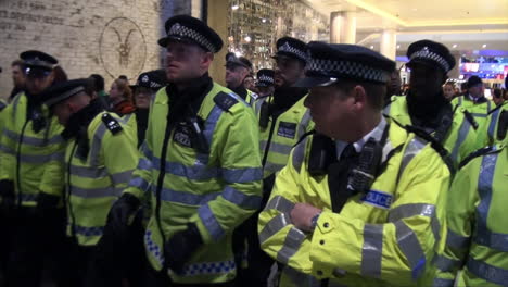 Dozens-of-Metropolitan-police-officers-walk-through-in-a-shopping-centre-during-a-Black-Lives-Matter-protest