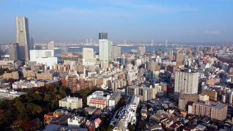 A-bustling-cityscape-with-skyscrapers-and-blue-sky,-aerial-view