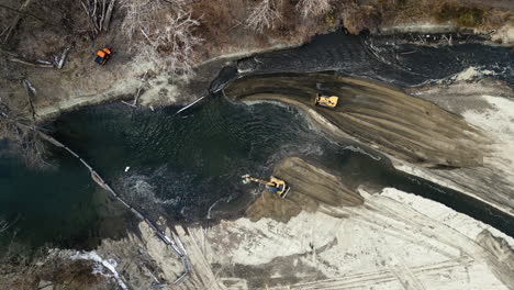 Aerial-view-of-bulldozers-and-excavators-working-to-divert-the-course-of-a-river