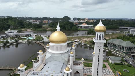 Aerial-drone-shot-of-golden-minarets-and-dome-on-the-Sultan-Omar-Ali-Saifuddien-Mosque-in-Bandar-Seri-Bagawan-in-Brunei-Darussalam