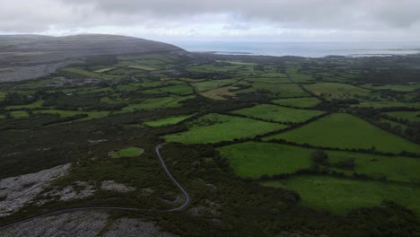 The-Burren-in-Ireland-with-rocky-hills-and-green-fields