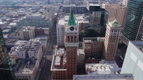 Aerial-View-of-Tribune-Tower-in-Downtown-Oakland,-California-USA,-Historic-Landmark-and-Skyscrapers,-Drone-Shot