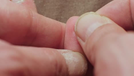 Cleaning-small-toe-nail-post-filing,-emphasizing-fungal-infection